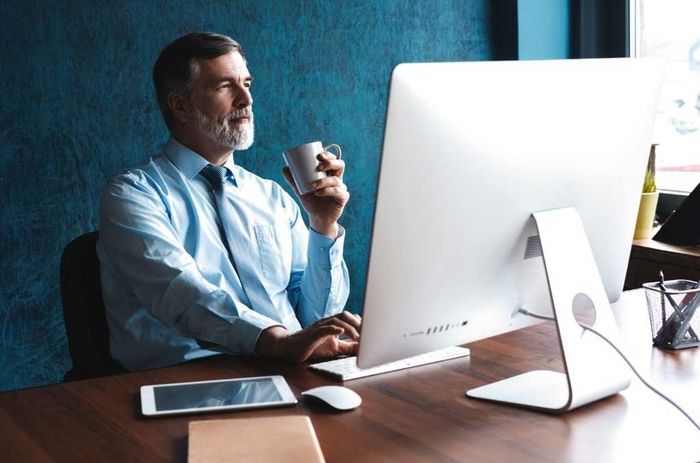 two people looking at a computer together