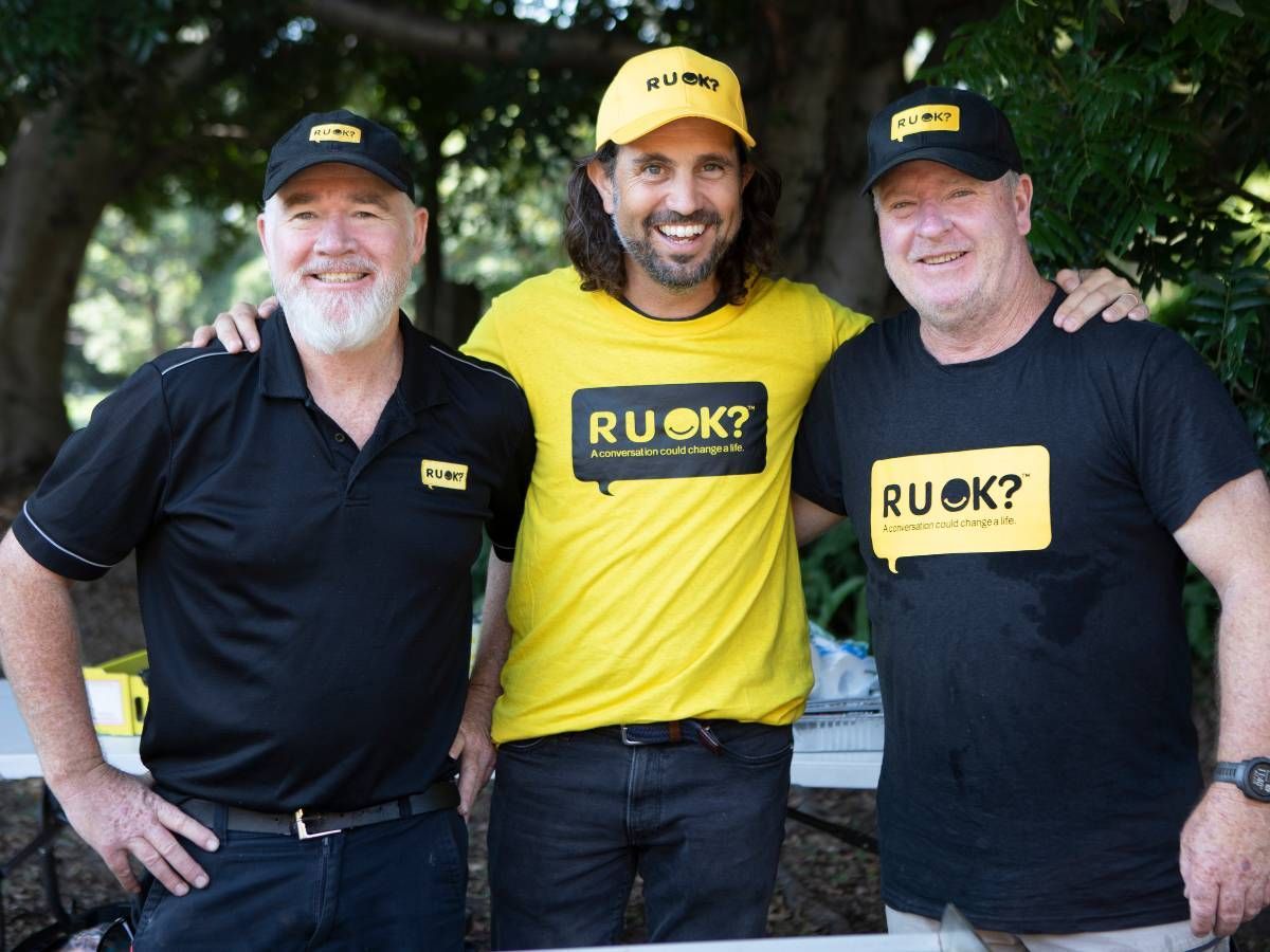 group of people smiling at outdoor R U OK? Day event