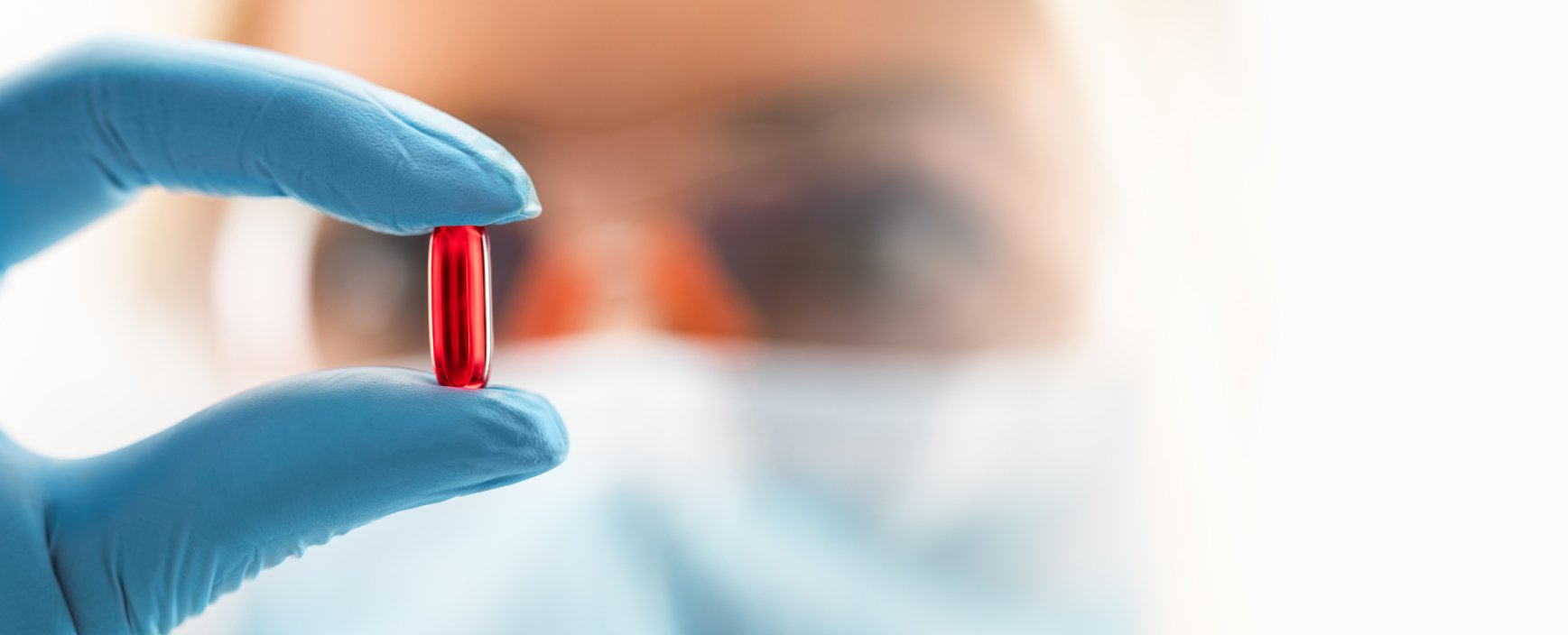 doctor holding pill