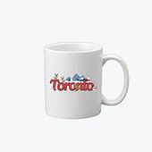 A white coffee mug with the word toronto on it.