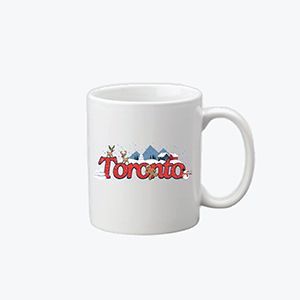 A white coffee mug with the word toronto on it.
