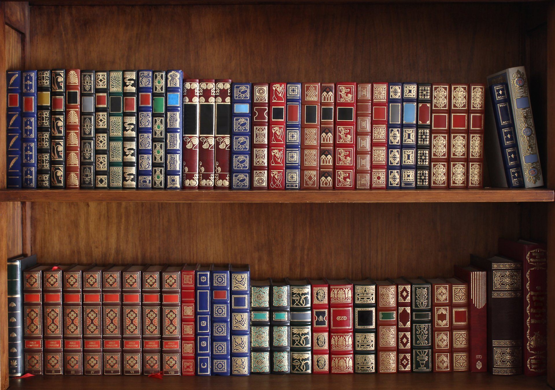 A bookshelf filled with books including one that says ' a ' on it